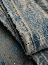 Load image into Gallery viewer, AMIRI paint-splatter detail denim jeans
