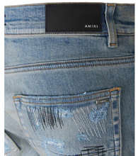 Load image into Gallery viewer, Amiri Distressed Mid-Rise Jeans
